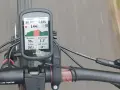 Na ekranie licznika Garmin widać dane z jazdy rowerem: prędkość 20 km/h, dystans 4.69 km, tętno 144 bpm (maksymalne 159 bpm), wysokość 90 m, temperaturę 5.3°C i spalone kalorie 161.