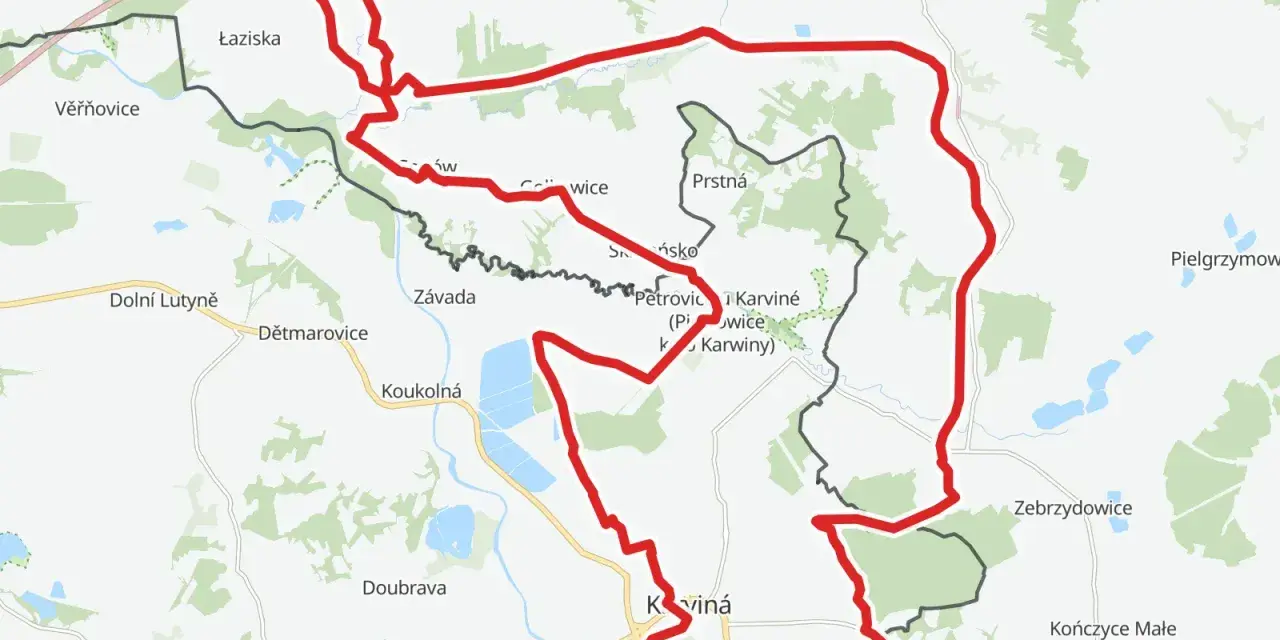 Mapa z zaznaczonym czerwonym szlakiem rowerowym, biegnącym przez tereny z nazwami miejscowości jak Łaziska, Petrovice, Karviná i Jastrzębie-Zdrój.