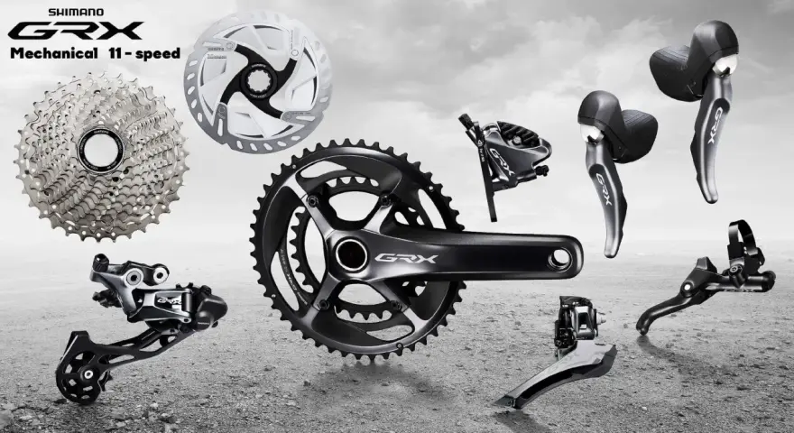 Komponenty rowerowe Shimano GRX: kaseta, korba, przerzutki, hamulce i manetki. Idealne do gravelowych wypraw.