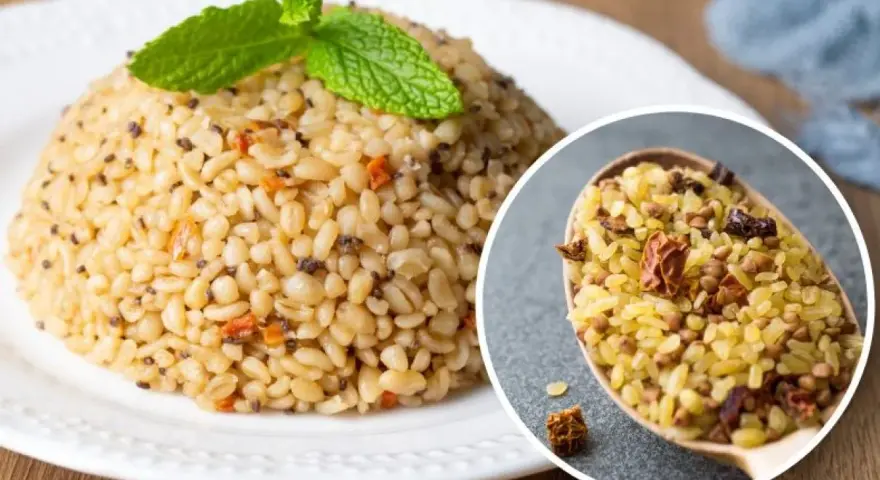 Kasza bulgur na talerzu, ozdobiona miętą. W zbliżeniu łyżka pełna kaszy z dodatkami. Odkryj jej zdrowe właściwości!