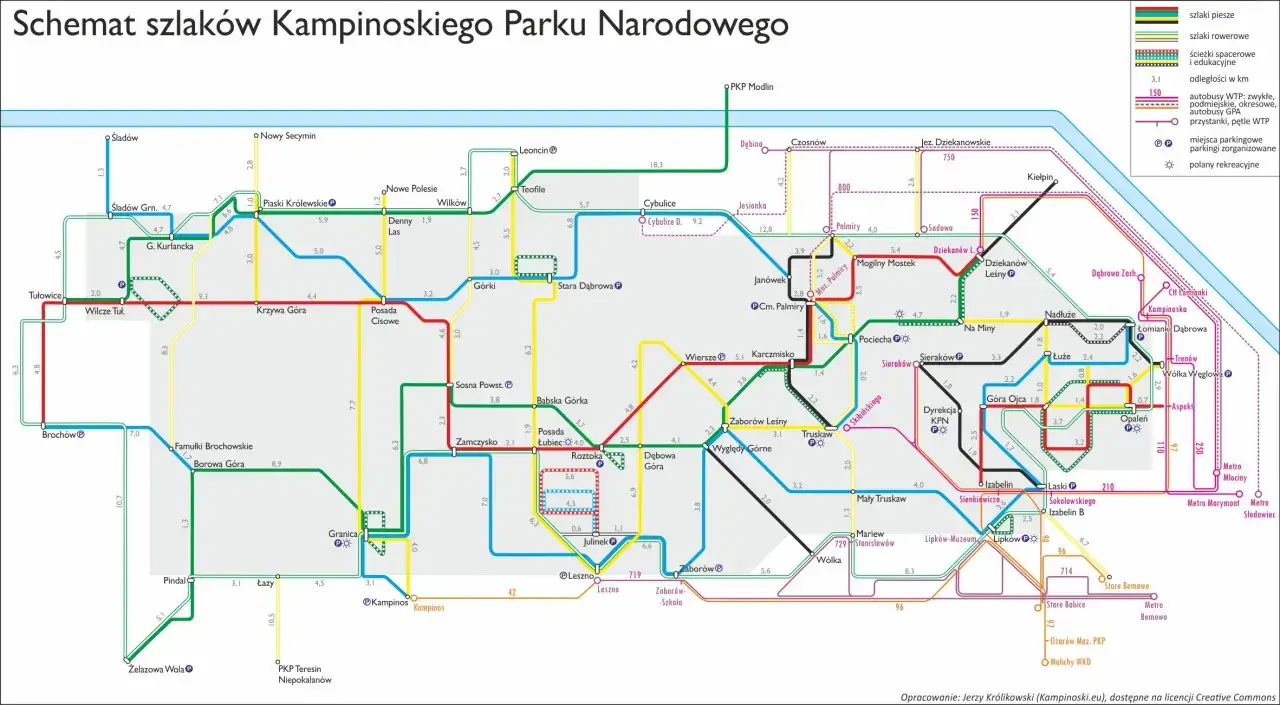 Mapa kampinoskiego szlaku rowerowego z zaznaczonymi trasami, parkingami i punktami rekreacyjnymi.